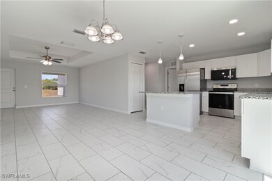 Kitchen with stainless steel appliances, marble fi