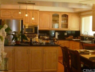 Kitchen view from entrance to Dining room, plenty of storage on both sides of island