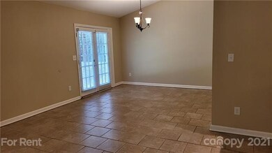 Dining area of great room overlooks patio and private back yard