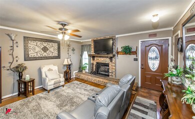 Living room with ceiling fan, dark hardwood / wood