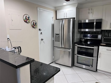 Ample kitchen. Bar and coffee area. Crown molding throughout