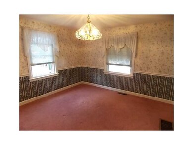 Dining Room. Hardwoods under carpeting in spacious
