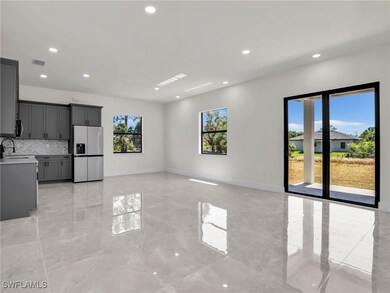 Unfurnished living room with visible vents, basebo