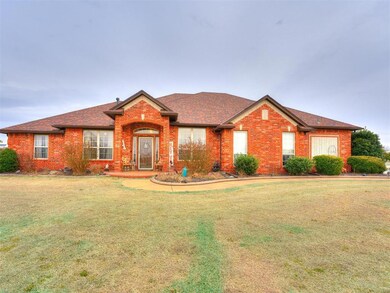 Ranch-style home featuring a front lawn