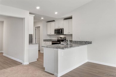 View of front of house featuring a garage and a fr