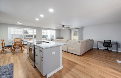Kitchen with ceiling fan, light hardwood / wood-st