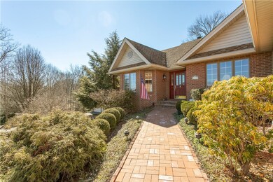 Brick pathway leads the way to the front entrance.