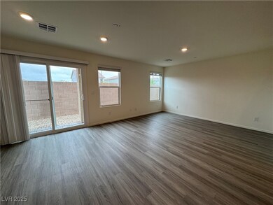 Spare room featuring baseboards, visible vents, an