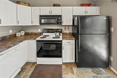 Tile flooring in kitchen, dining and living room a