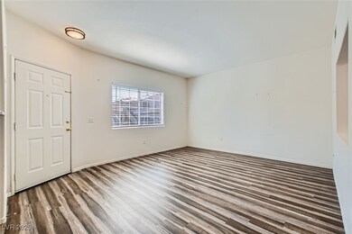 Entrance foyer featuring wood finished floors and baseboards