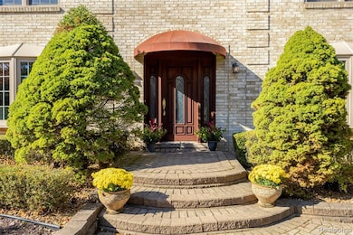 View of exterior entry with brick siding