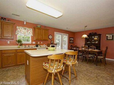 Kitchen. Tons of space, breakfast bar area and brand new floors.
