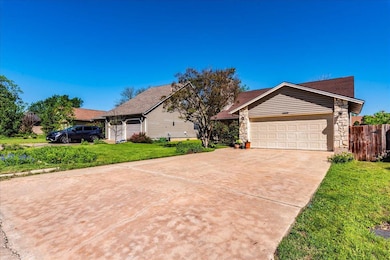 Ranch-style home with an attached garage, concret