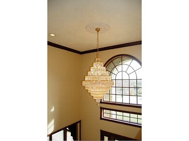 Entry/Foyer. Chandelier is on a remote to lower fo