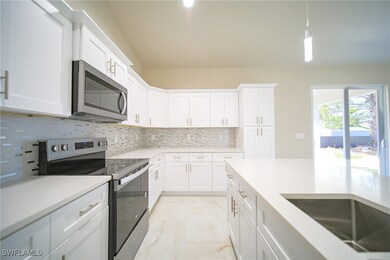 The Island Kitchen Comes With Quartz Countertops, Real Wood Flat Panel Cabinets & Drawers, A Floor To Ceiling Pantry, Brand New Stainless Steel Appliances, And A Tile Backsplash!