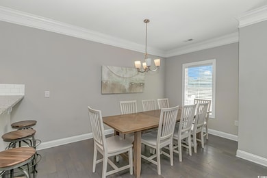 Dining room featuring an inviting chandelier, crow