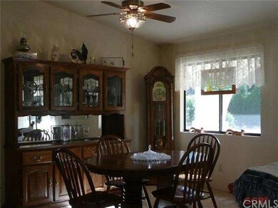 Dining area with ceiling fan.