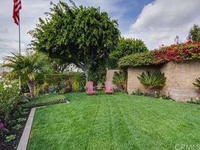 Lush greenery and beautiful flowers decorate this 