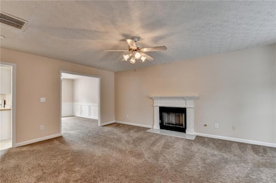 Unfurnished living room featuring a fireplace with