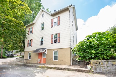 Rear of the property with door to Apartment 1