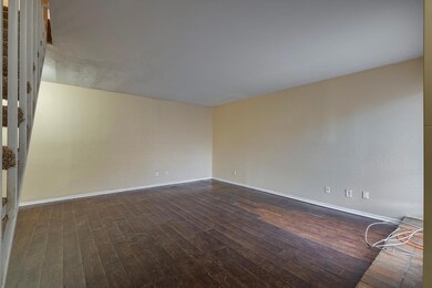 Living room featuring dark wood-type flooring.