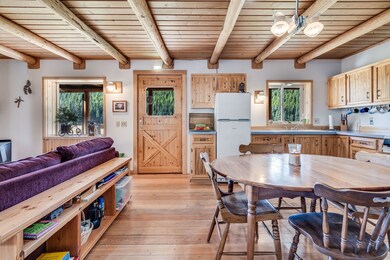Front entry with living room on the left and dining room and kitchen on the right