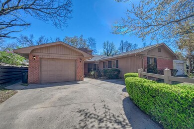Mature landscaping with blooming trees in front