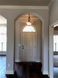 Entryway with new vinyl plank flooring and fresh p