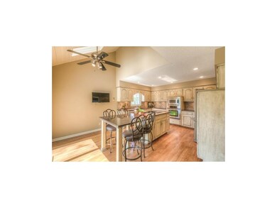 Spacious kitchen with vaulted ceilings and skyligh