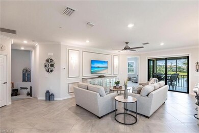 Tiled living room with crown molding and ceiling f