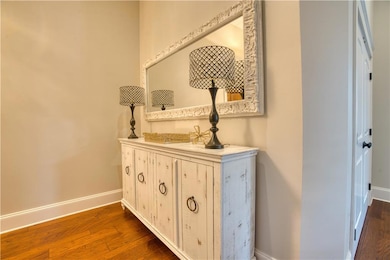 Detailed view of baseboards and wood finished floors