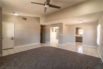 Great room features vaulted ceiling, cozy gas fire