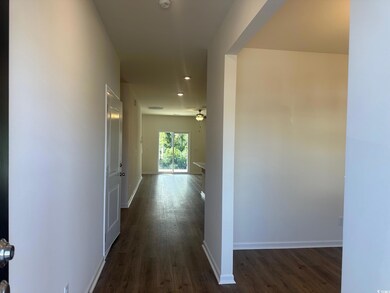 Hall featuring dark wood-type flooring