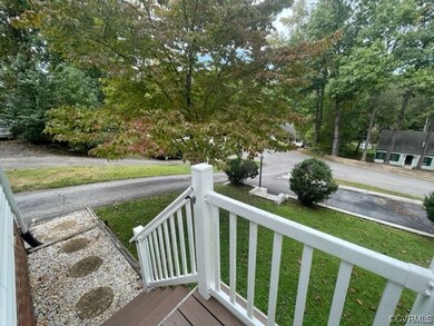 Wooden deck featuring a lawn