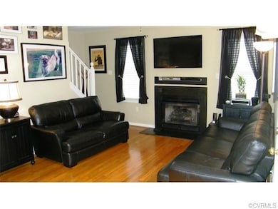 Family Room Features Gas Log Fireplace and Beautif