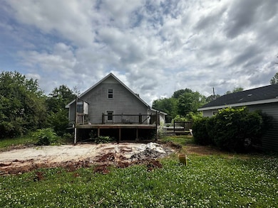 Rear view of house featuring a deck