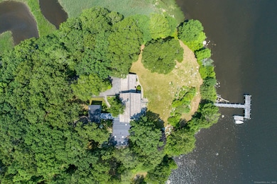An extraordinary private peninsula, with frontage and docks on both the CT river and Turtle Creek, which is land trust owned.