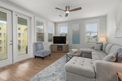 Windows let in views of beach and lots of natural