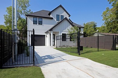 View of front of house featuring driveway, board 