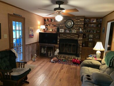 Den with gas log fireplace