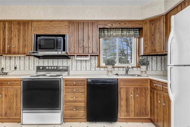16 x 11 Kitchen looks out on fenced in yard.