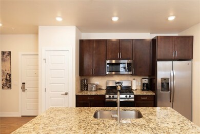 Granite slab countertops and stainless steel appli
