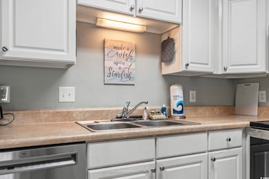 Kitchen featuring stainless steel appliances, sink
