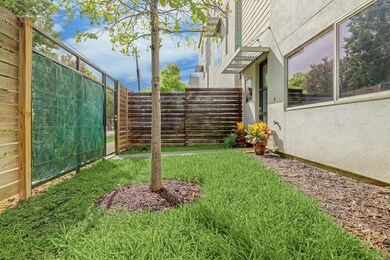 Fence accented with faux greenery for privacy