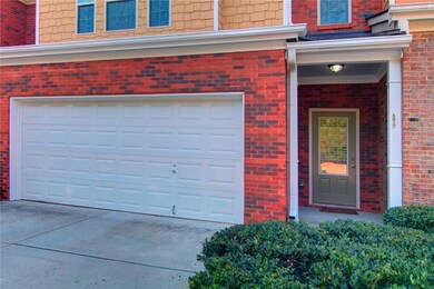 Garage featuring concrete driveway