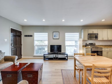 Living room with light wood-type flooring