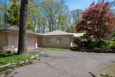 Enjoy the beautiful grounds at 291 Peddlers Rd in Guilford. A two car garage is located on the left side of the home leading to the sunroom.