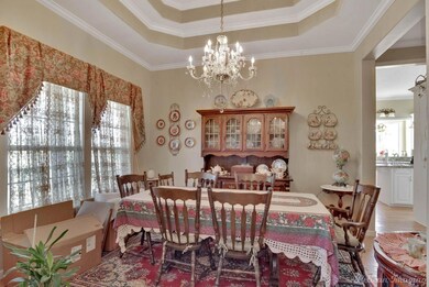 Dining space featuring ornamental molding, a notab
