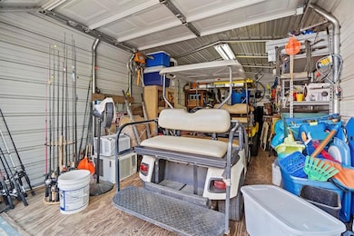 Garage featuring metal wall