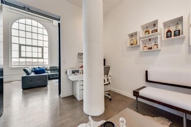 Home office with dark wood-type flooring